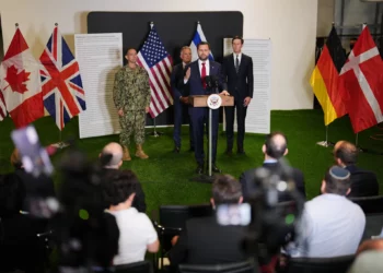 US Vice President JD Vance speaks to the media as US Special Envoy to the Middle East Steve Witkoff and Jared Kushner stand next to him, in Kiryat Gat, Israel, October 21, 2025. (AP/Francisco Seco)