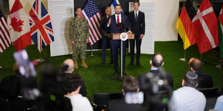 US Vice President JD Vance speaks to the media as US Special Envoy to the Middle East Steve Witkoff and Jared Kushner stand next to him, in Kiryat Gat, Israel, October 21, 2025. (AP/Francisco Seco)