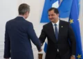 Deputy Commander of the Libyan National Army, Lieutenant General Saddam Haftar, right, shakes hands with Greece’s Prime Minister Kyriakos Mitsotakis, in Athens, on June 15, 2026. (AP/Petros Giannakouris)