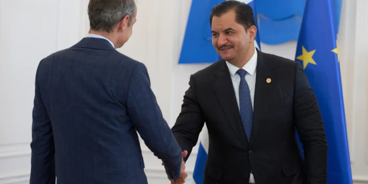 Deputy Commander of the Libyan National Army, Lieutenant General Saddam Haftar, right, shakes hands with Greece’s Prime Minister Kyriakos Mitsotakis, in Athens, on June 15, 2026. (AP/Petros Giannakouris)