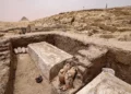 Visitors tour the site in the Saqqara necropolis south of Cairo, where archaeologists unearthed two human and animal embalming workshops, as well as two tombs, on May 27, 2023. (Khaled Desouki/AFP)