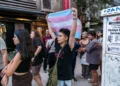 A protester holds a transgender flag during a demonstration against the arrests of LGBTQ activists in Izmir, on September 14, 2026. (Murat Kocabas/AFP)