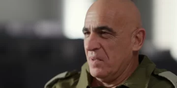 Reservist commander Yossi Bachar speaks to Kan, in November 2023 (Video screenshot)