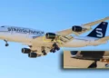 Detalle de un cohete desconocido bajo el ala izquierda del Boeing 747 de Stratolaunch